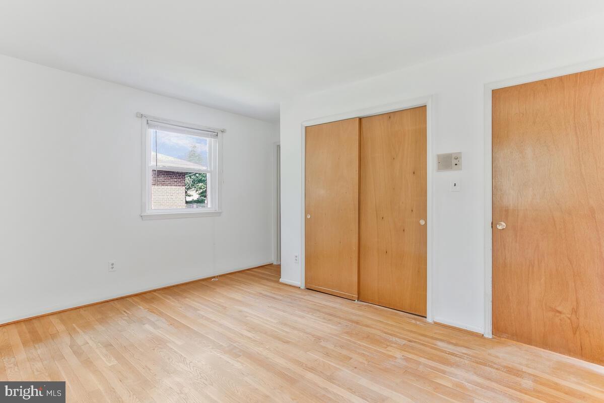 12412 Palermo Drive Silver Spring, MD 20904 - Photo 19 of 43 a view of an empty room with wooden floor and a window