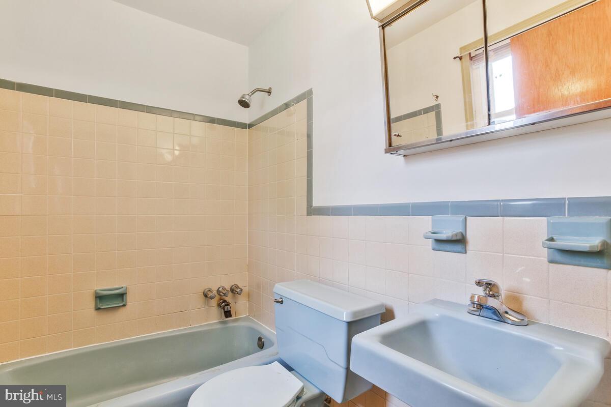 12412 Palermo Drive Silver Spring, MD 20904 - Photo 21 of 43 a bathroom with a sink a toilet and shower