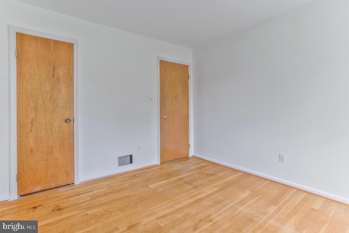 12412 Palermo Drive Silver Spring, MD 20904 - Photo 23 of 43 a view of empty room with wooden floor