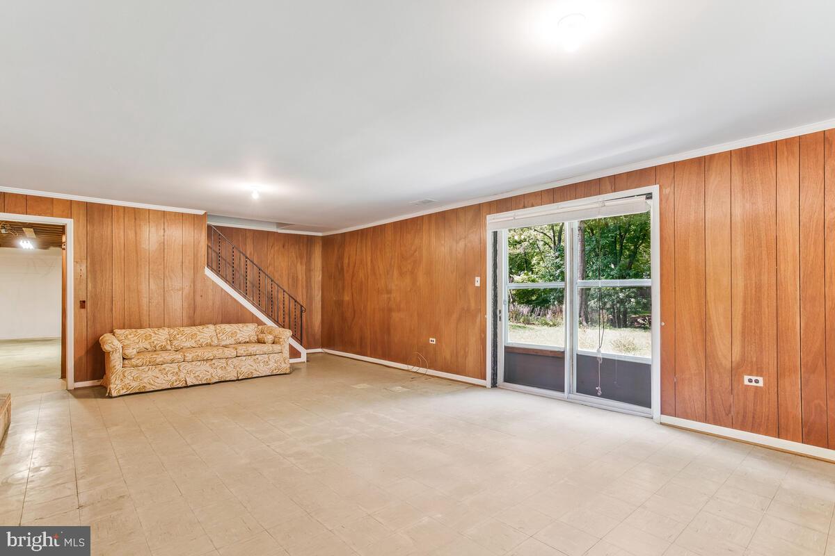 12412 Palermo Drive Silver Spring, MD 20904 - Photo 30 of 43 an empty room with a fireplace and windows