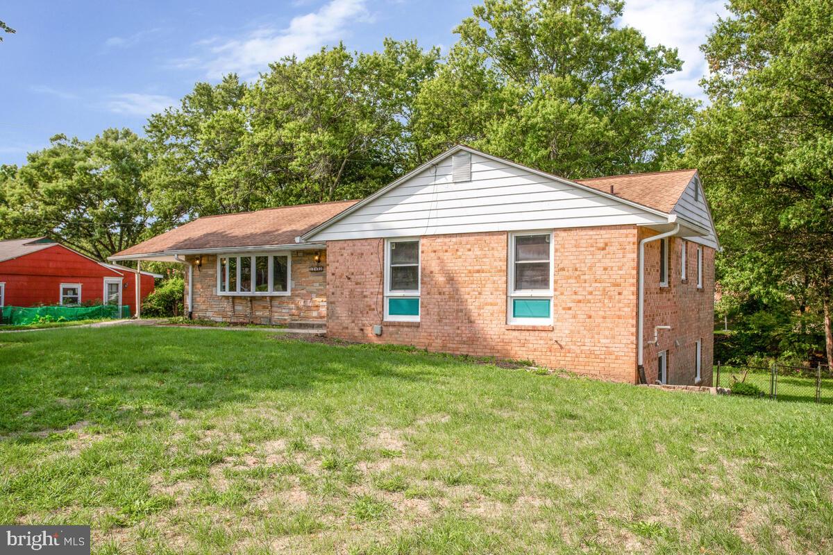 12412 Palermo Drive Silver Spring, MD 20904 - Photo 3 of 43 a front view of a house with a garden