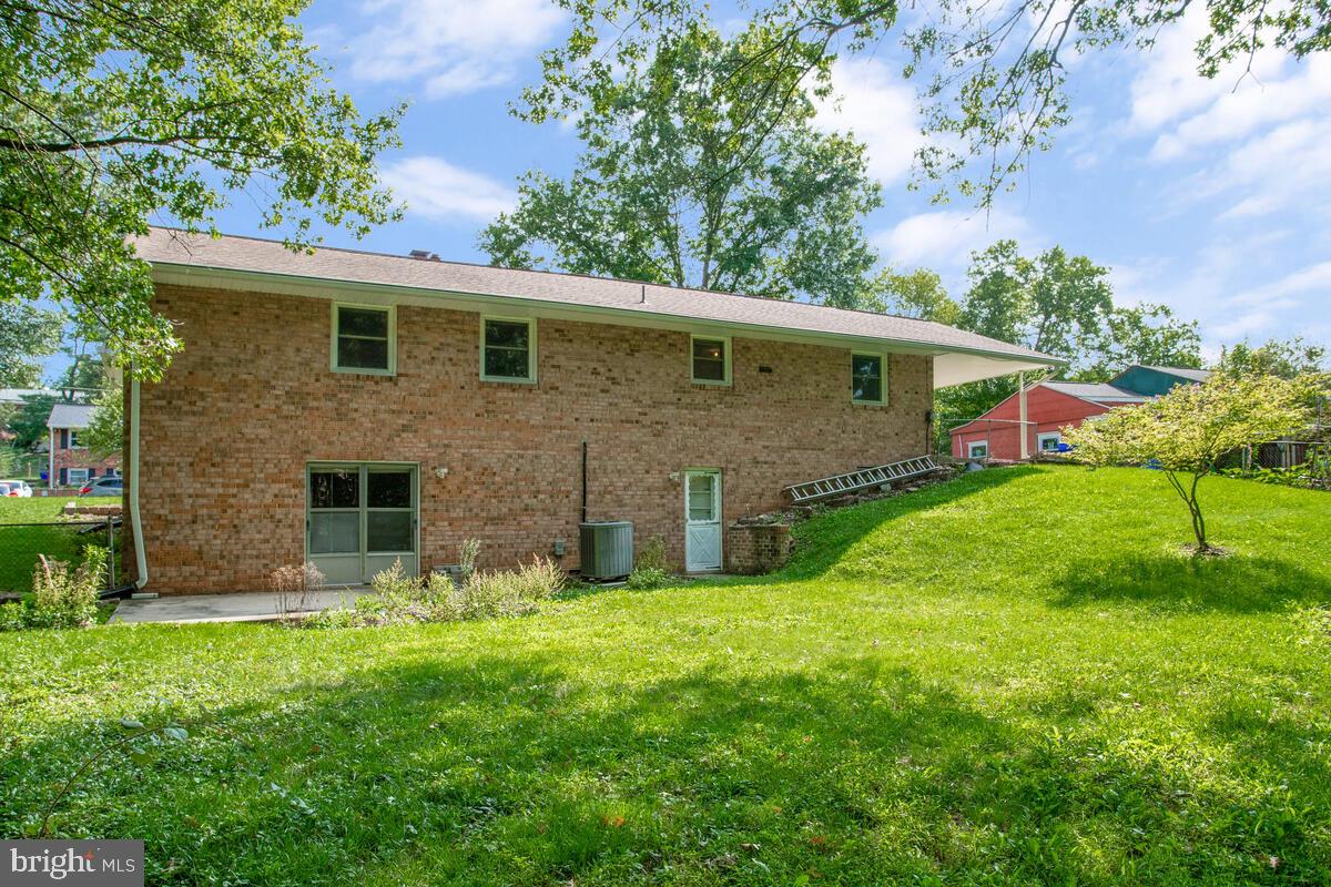 12412 Palermo Drive Silver Spring, MD 20904 - Photo 38 of 43 a front view of a house with a yard and garage