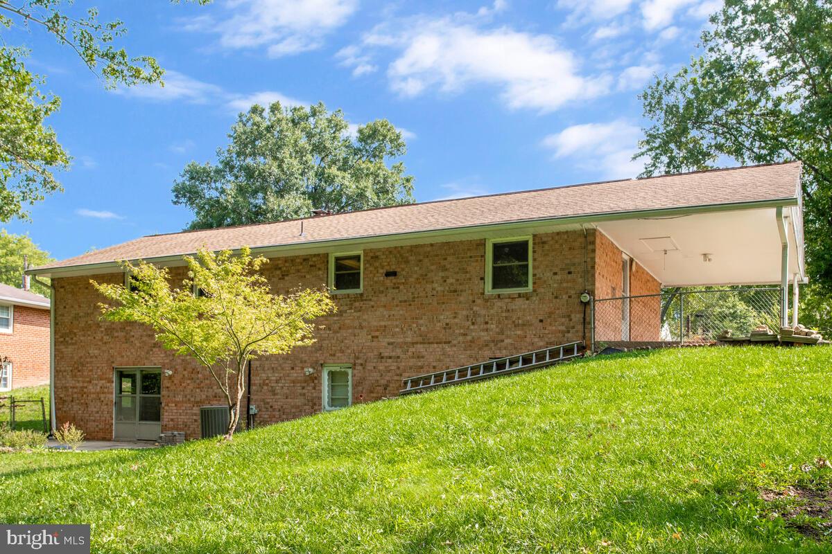 12412 Palermo Drive Silver Spring, MD 20904 - Photo 39 of 43 a view of a house with brick walls plants and large tree