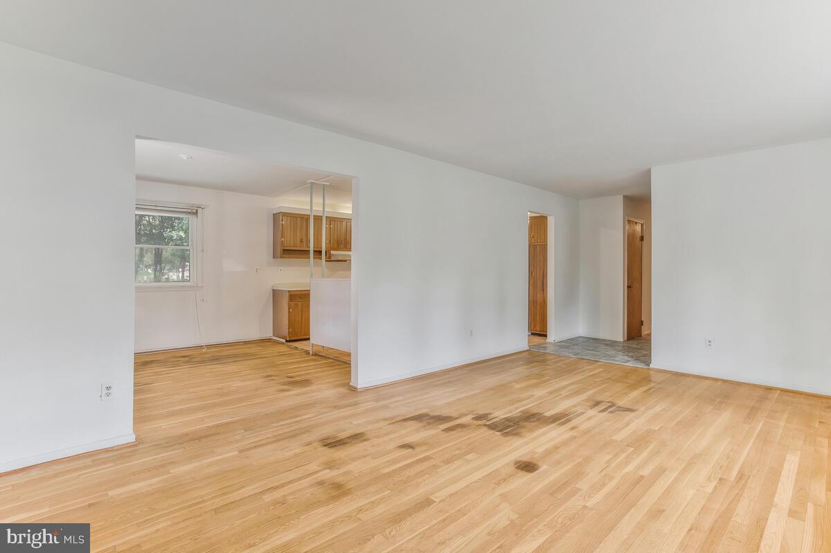 12412 Palermo Drive Silver Spring, MD 20904 - Photo 10 of 43 a view of an empty room with wooden floor and a window