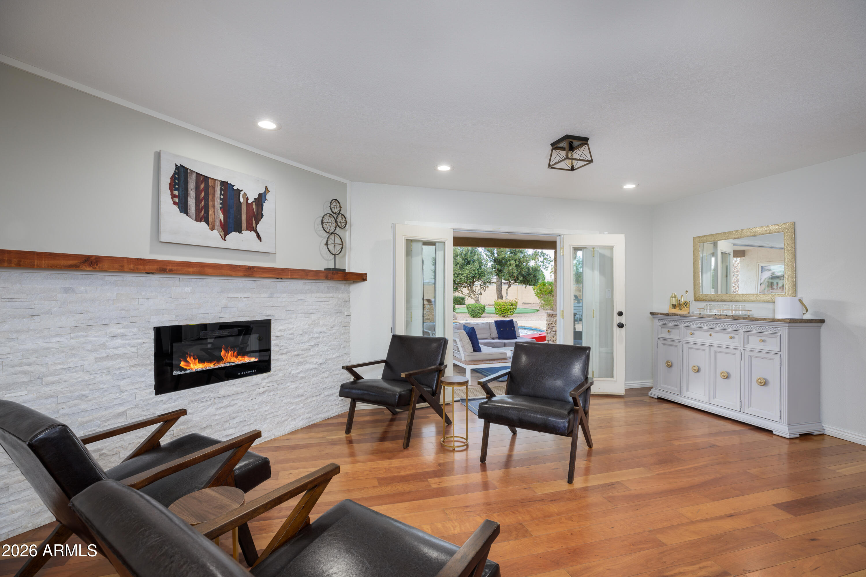 6932 East Presidio Road Scottsdale, AZ 85254 - Photo 10 of 30 a living room with furniture and a fireplace