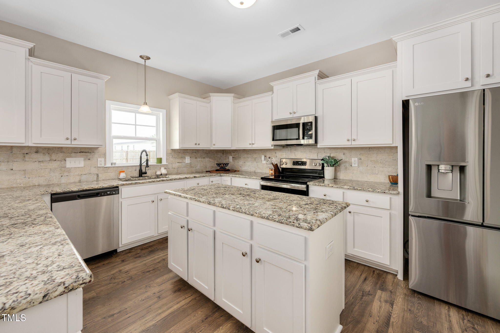 40 Kenbridge Lane Princeton, NC 27569 - Photo 11 of 36 a kitchen with cabinets stainless steel appliances a sink and a window