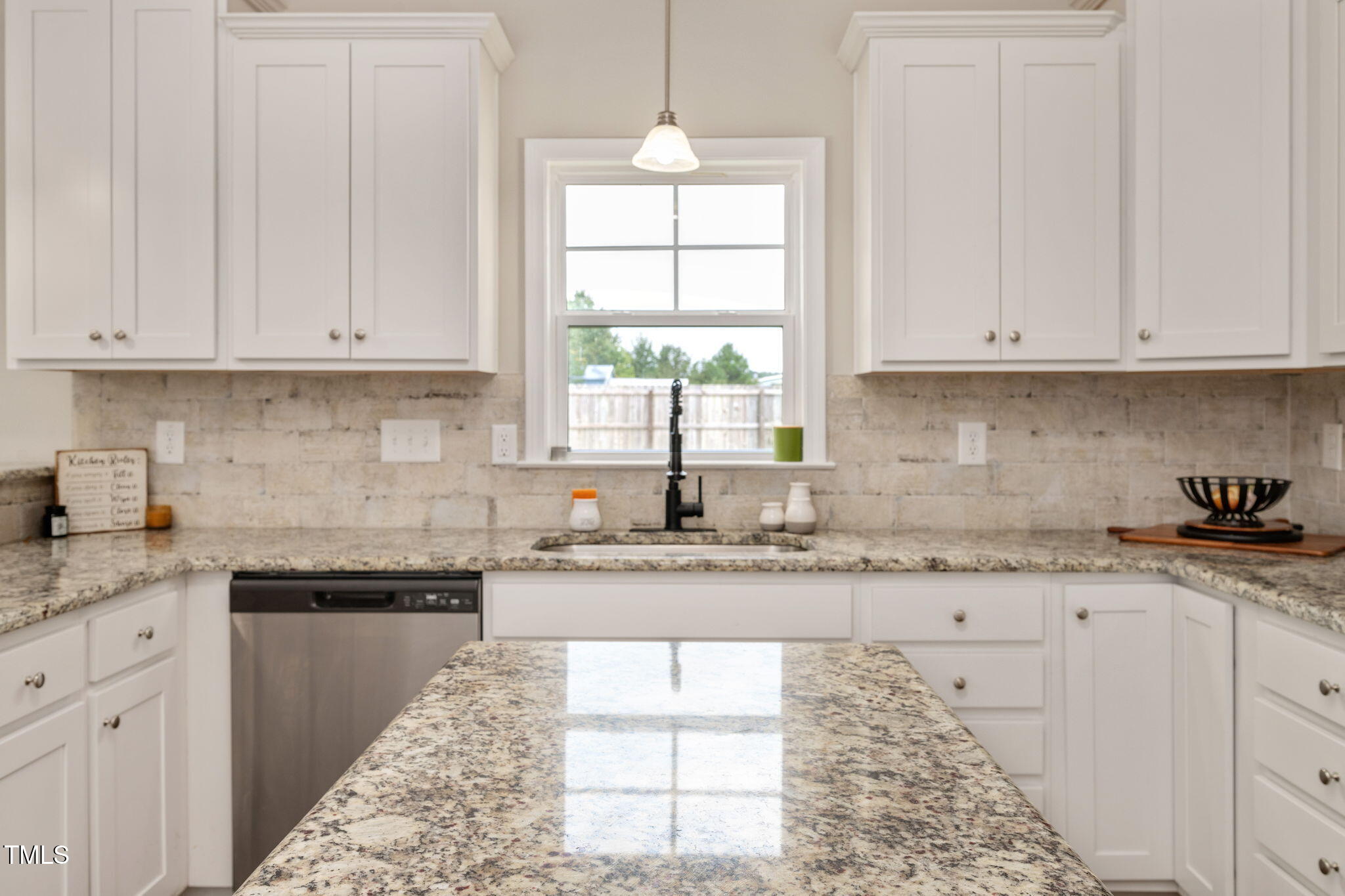 40 Kenbridge Lane Princeton, NC 27569 - Photo 13 of 36 a kitchen with granite countertop white cabinets white appliances and a window