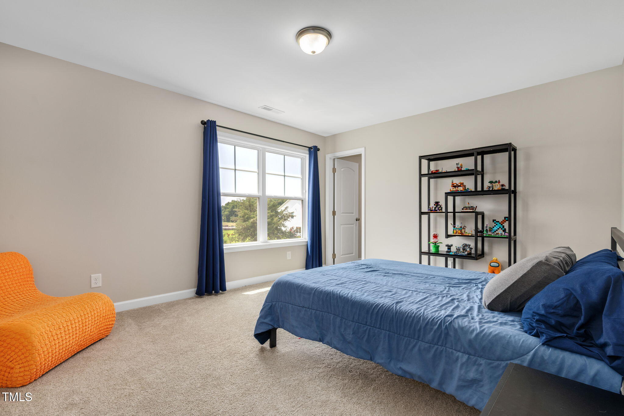 40 Kenbridge Lane Princeton, NC 27569 - Photo 21 of 36 a spacious bedroom with a bed and a window