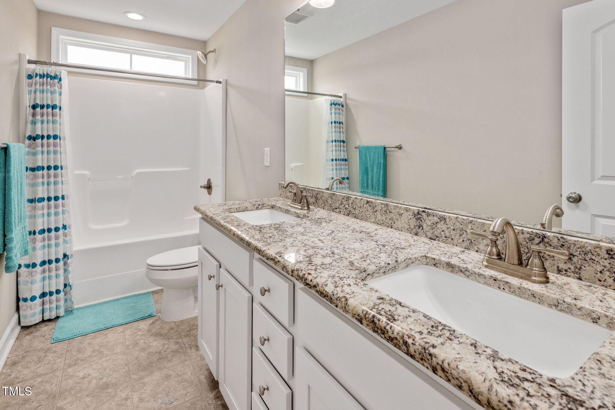 40 Kenbridge Lane Princeton, NC 27569 - Photo 25 of 36 a bathroom with a granite countertop sink a toilet and shower