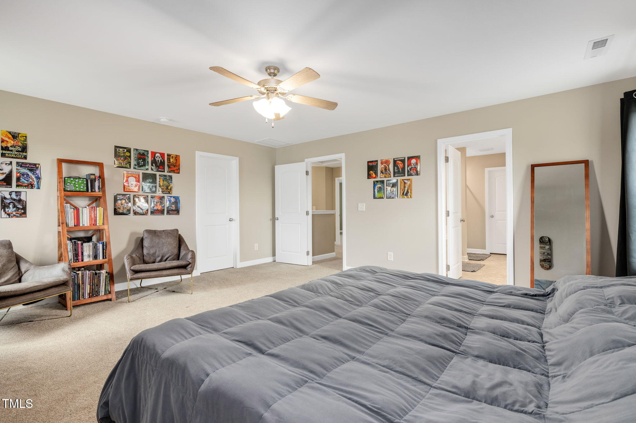 40 Kenbridge Lane Princeton, NC 27569 - Photo 27 of 36 a bedroom with a large bed and a chandelier