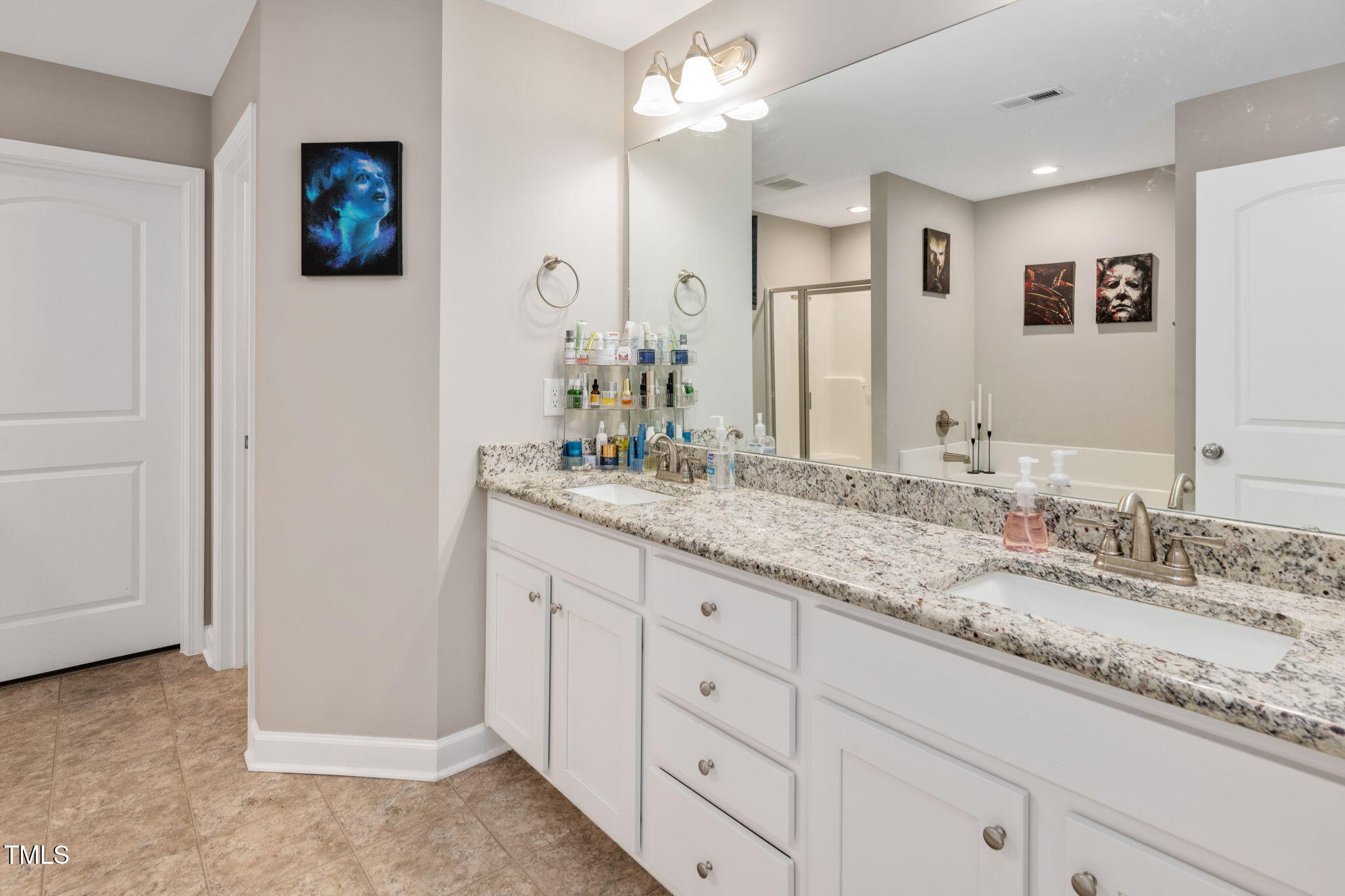 40 Kenbridge Lane Princeton, NC 27569 - Photo 28 of 36 a bathroom with a granite countertop double vanity sink and a mirror