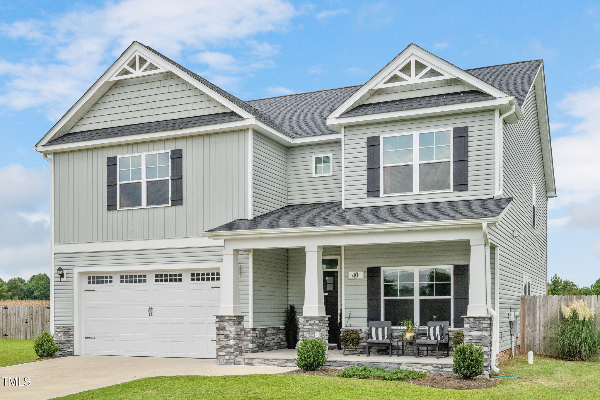 40 Kenbridge Lane Princeton, NC 27569 - Photo 3 of 36 a front view of a house with garden
