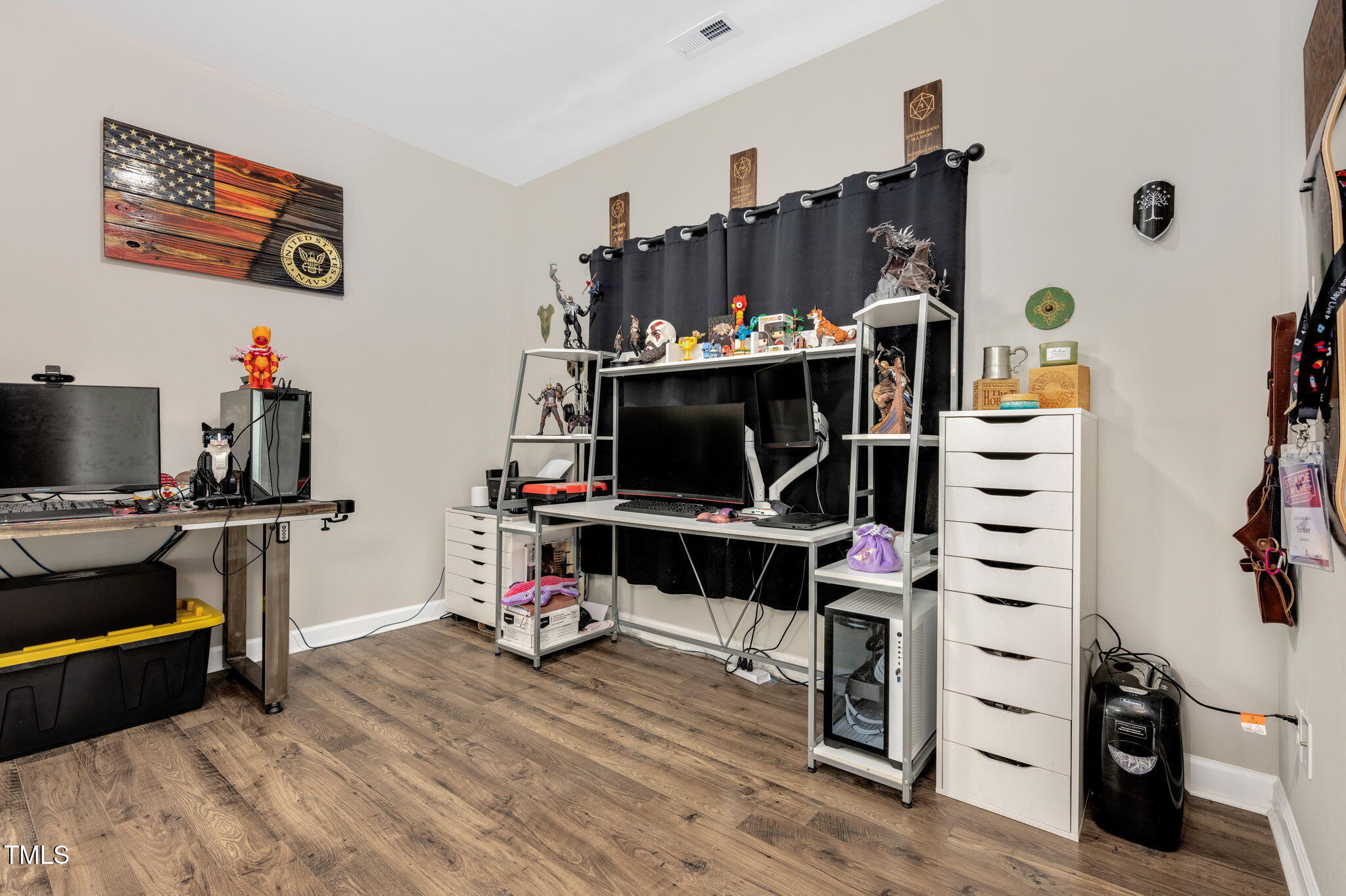 40 Kenbridge Lane Princeton, NC 27569 - Photo 7 of 36 a view of a workspace with furniture and a flat screen tv