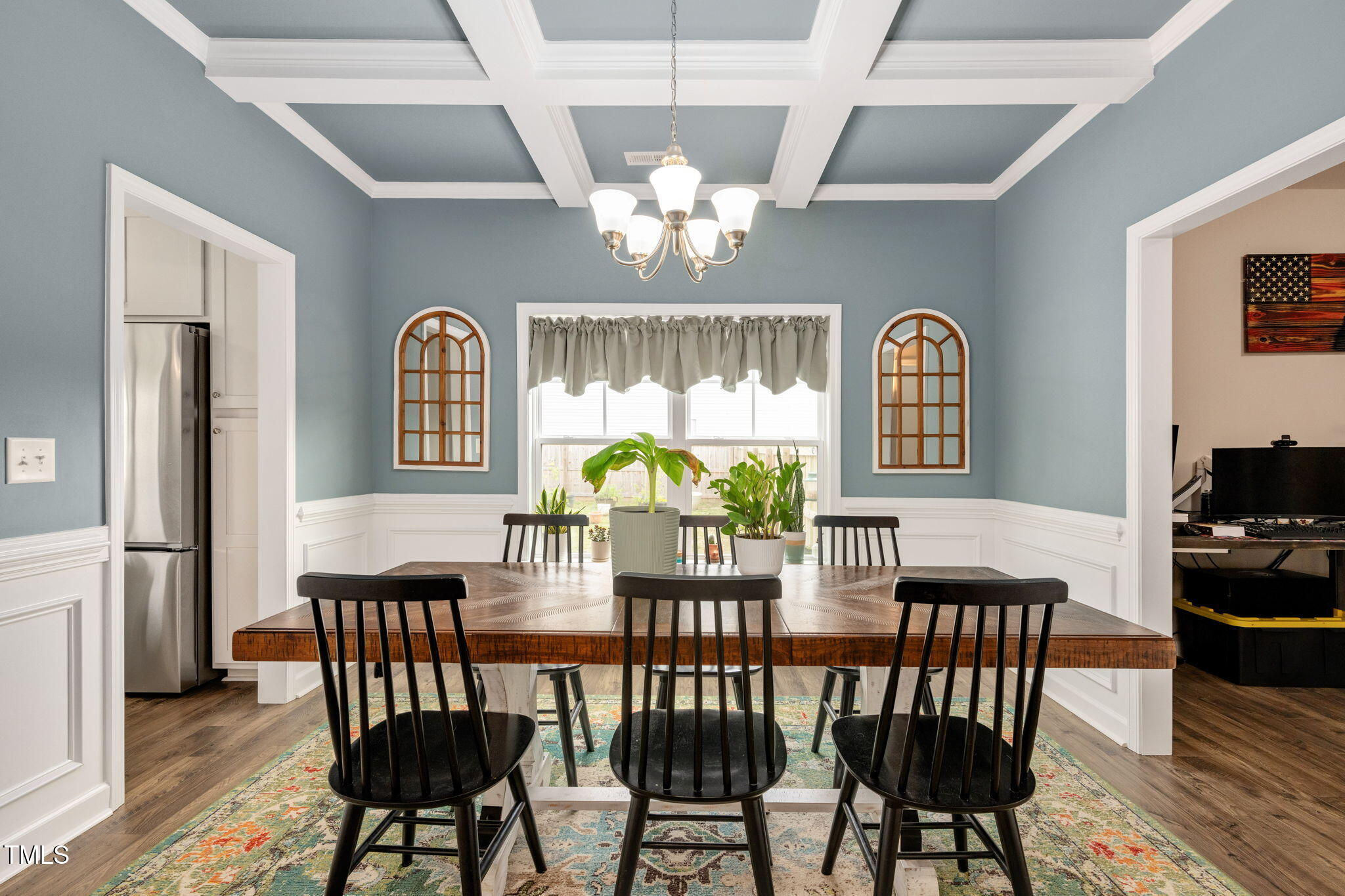 40 Kenbridge Lane Princeton, NC 27569 - Photo 9 of 36 a view of a dining room with furniture a chandelier and wooden floor