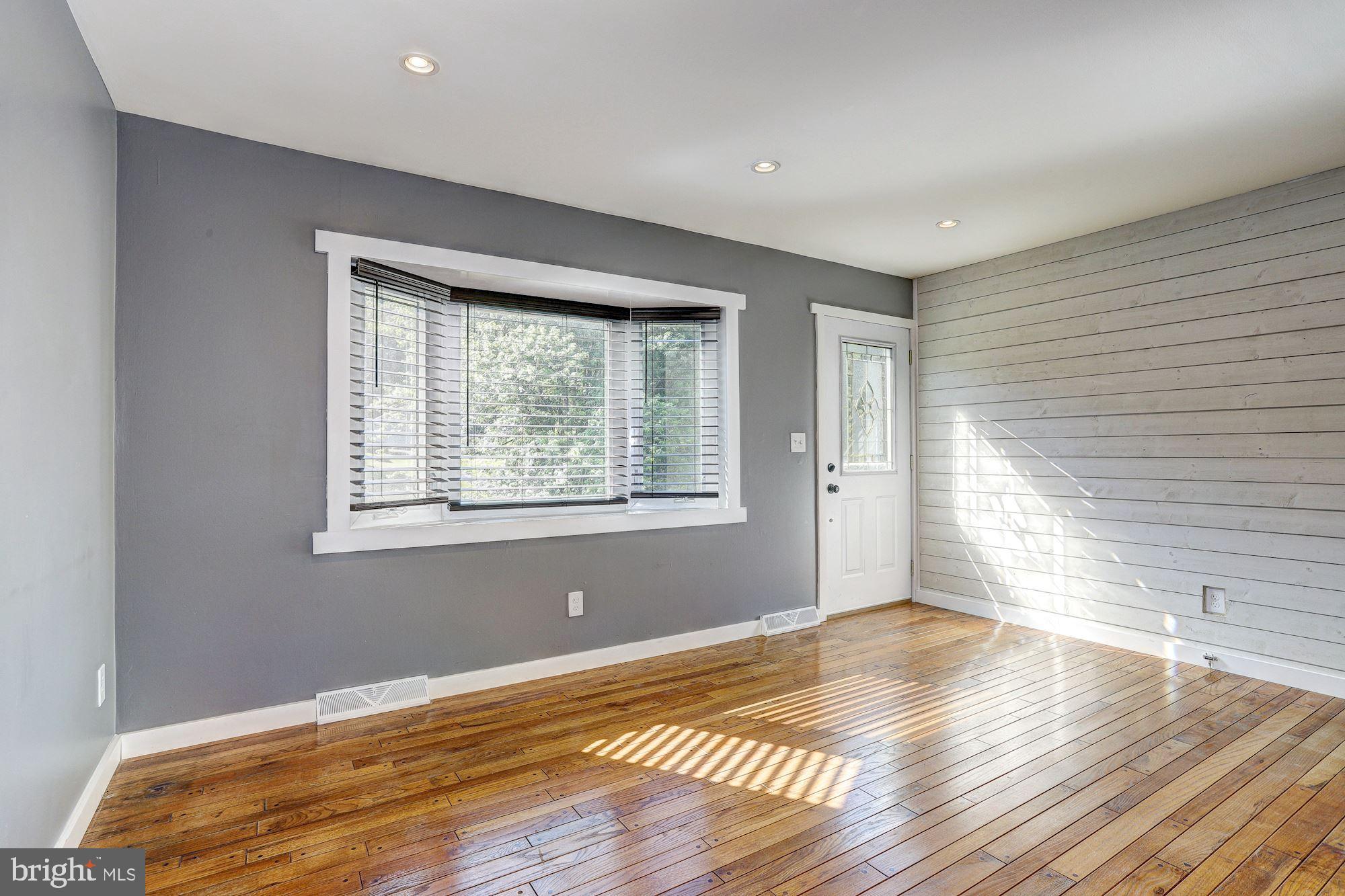 1818 Benedict Road Westminster, MD 21157 - Photo 2 of 32 Living Room | Hardwood Floors | Shiplap Walls