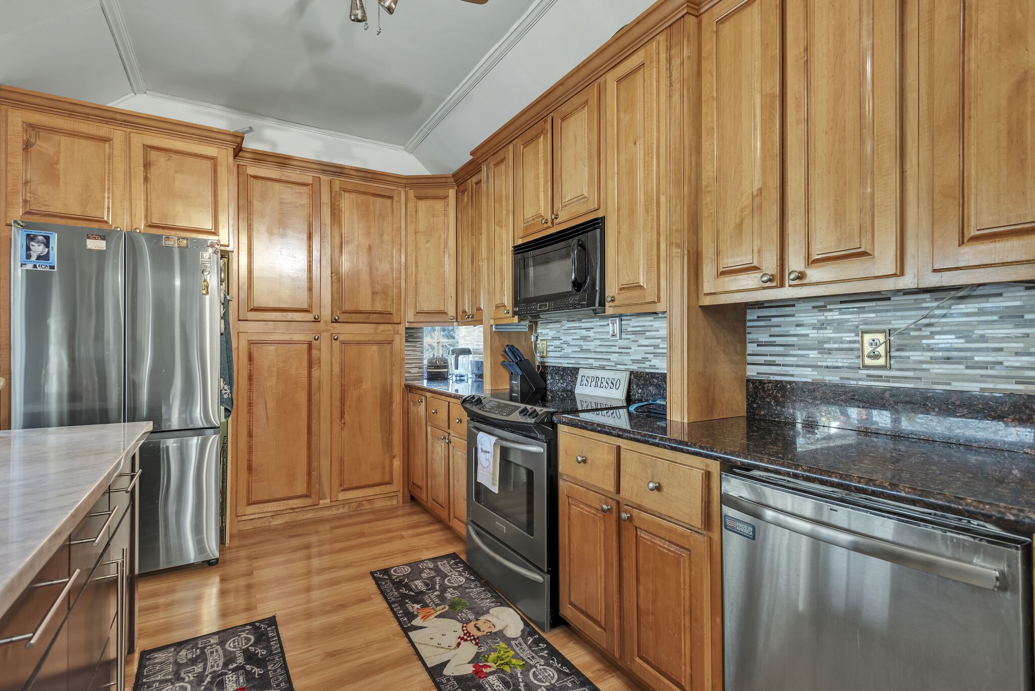 413 Mercomatic Drive Nashville, TN 37209 - Photo 11 of 29 a kitchen with stainless steel appliances granite countertop a refrigerator stove and sink