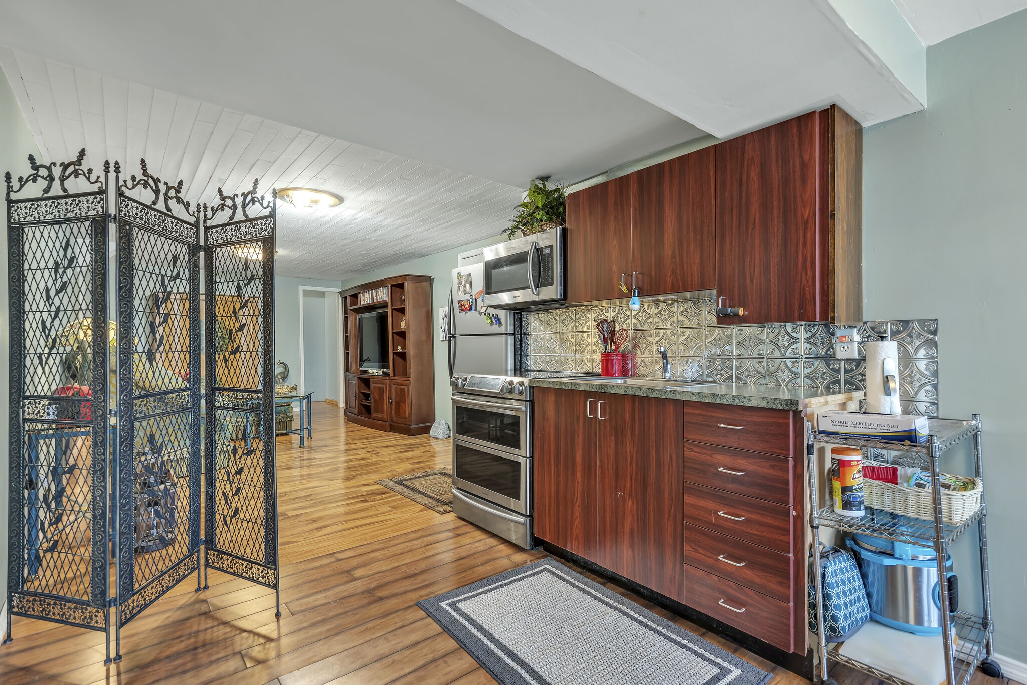 413 Mercomatic Drive Nashville, TN 37209 - Photo 23 of 29 a kitchen with granite countertop wooden cabinets and stainless steel appliances