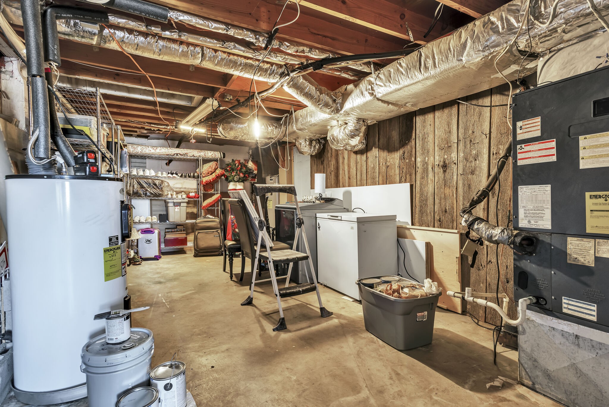 413 Mercomatic Drive Nashville, TN 37209 - Photo 25 of 29 a view of a storage room with water heater and racks