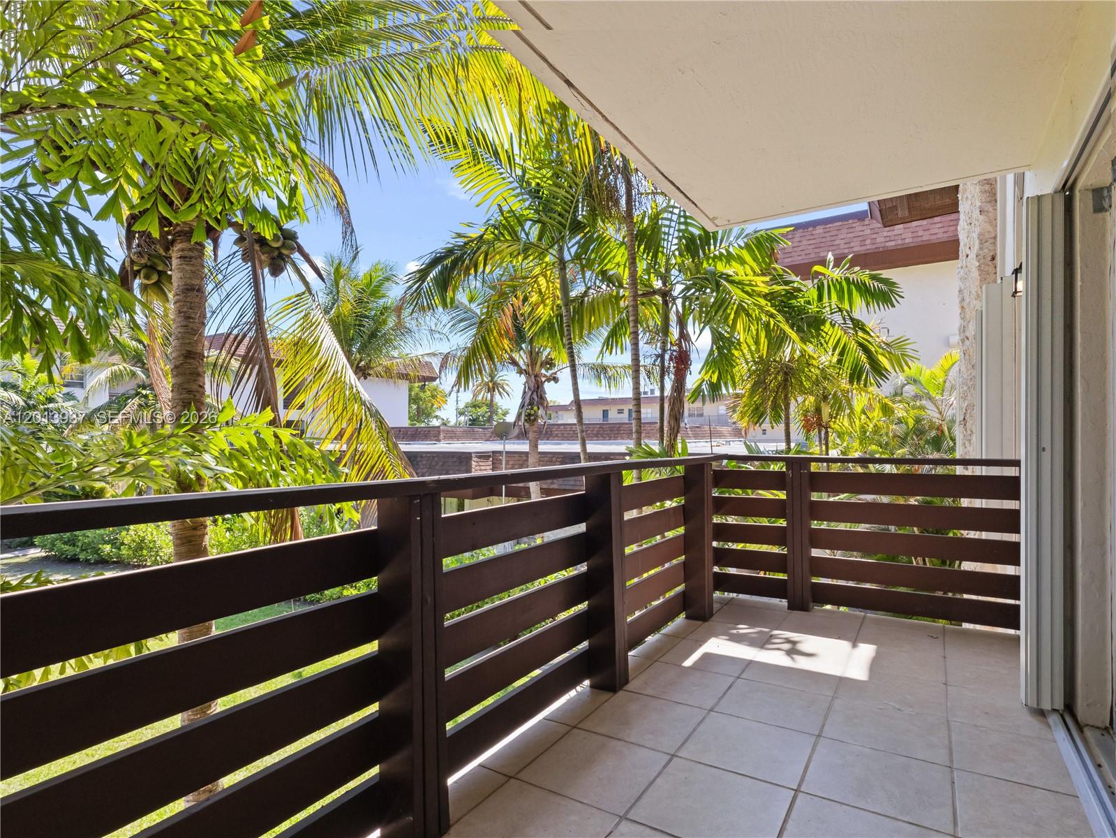 7487 Southwest 82nd Street, Unit C208 Miami, FL 33143 - Photo 20 of 28 a view of outdoor space with deck