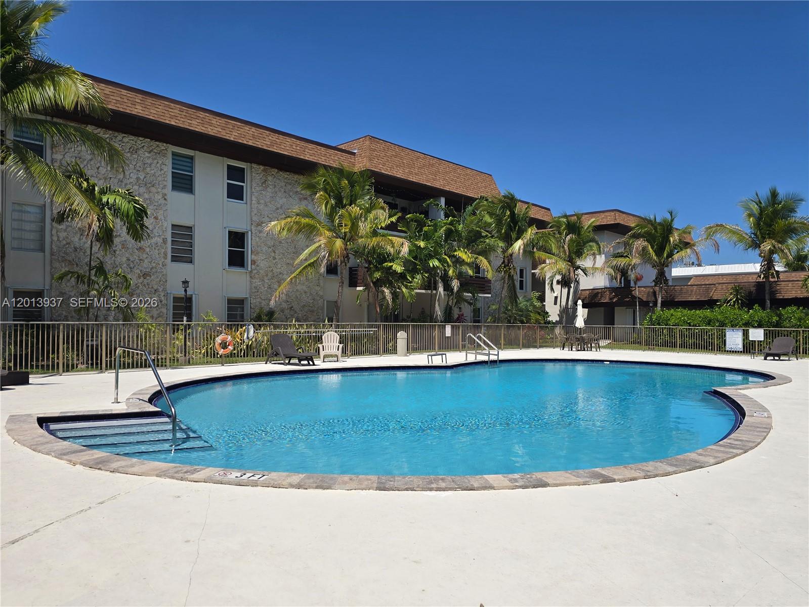 7487 Southwest 82nd Street, Unit C208 Miami, FL 33143 - Photo 22 of 28 a view of a fountain is middle in the backyard