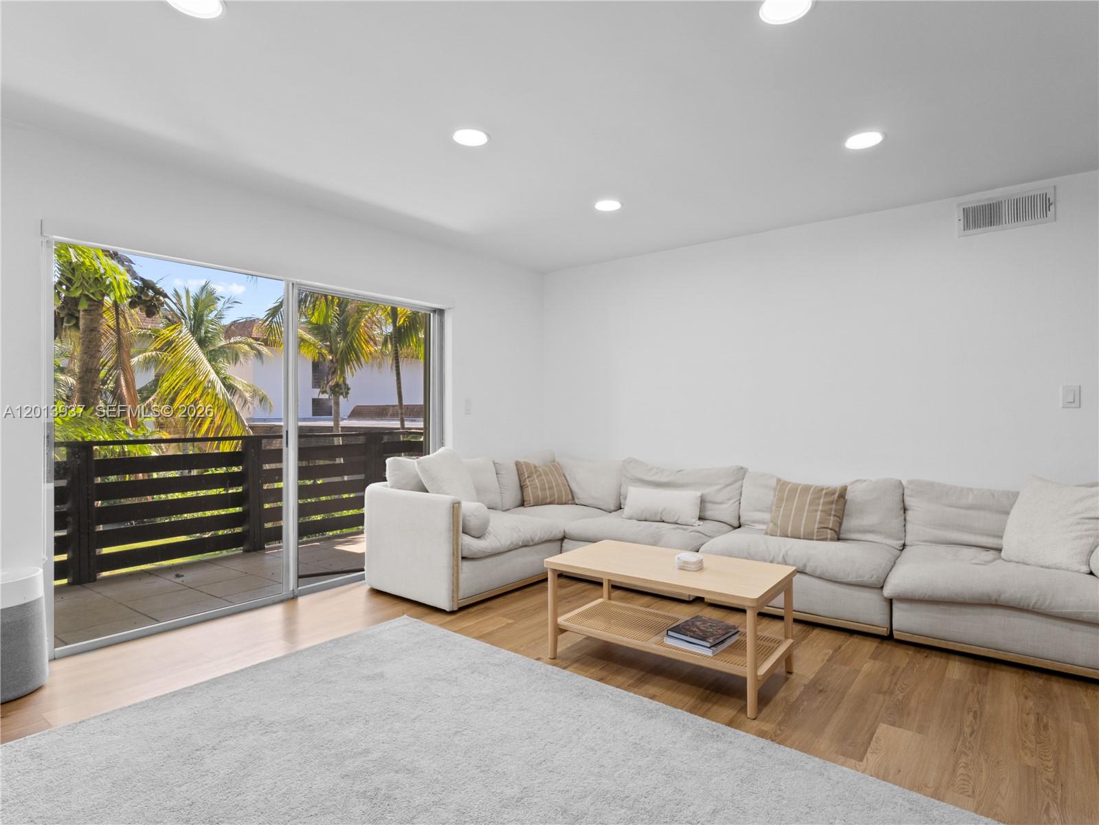 7487 Southwest 82nd Street, Unit C208 Miami, FL 33143 - Photo 3 of 28 a living room with furniture and a window