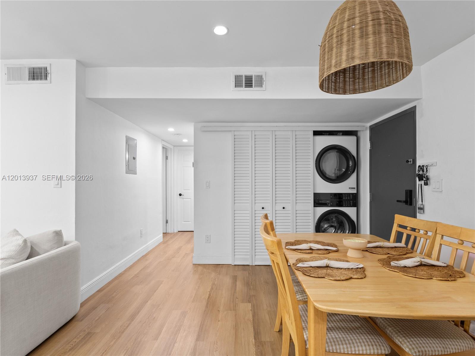 7487 Southwest 82nd Street, Unit C208 Miami, FL 33143 - Photo 8 of 28 a view of a dining room with furniture and wooden floor