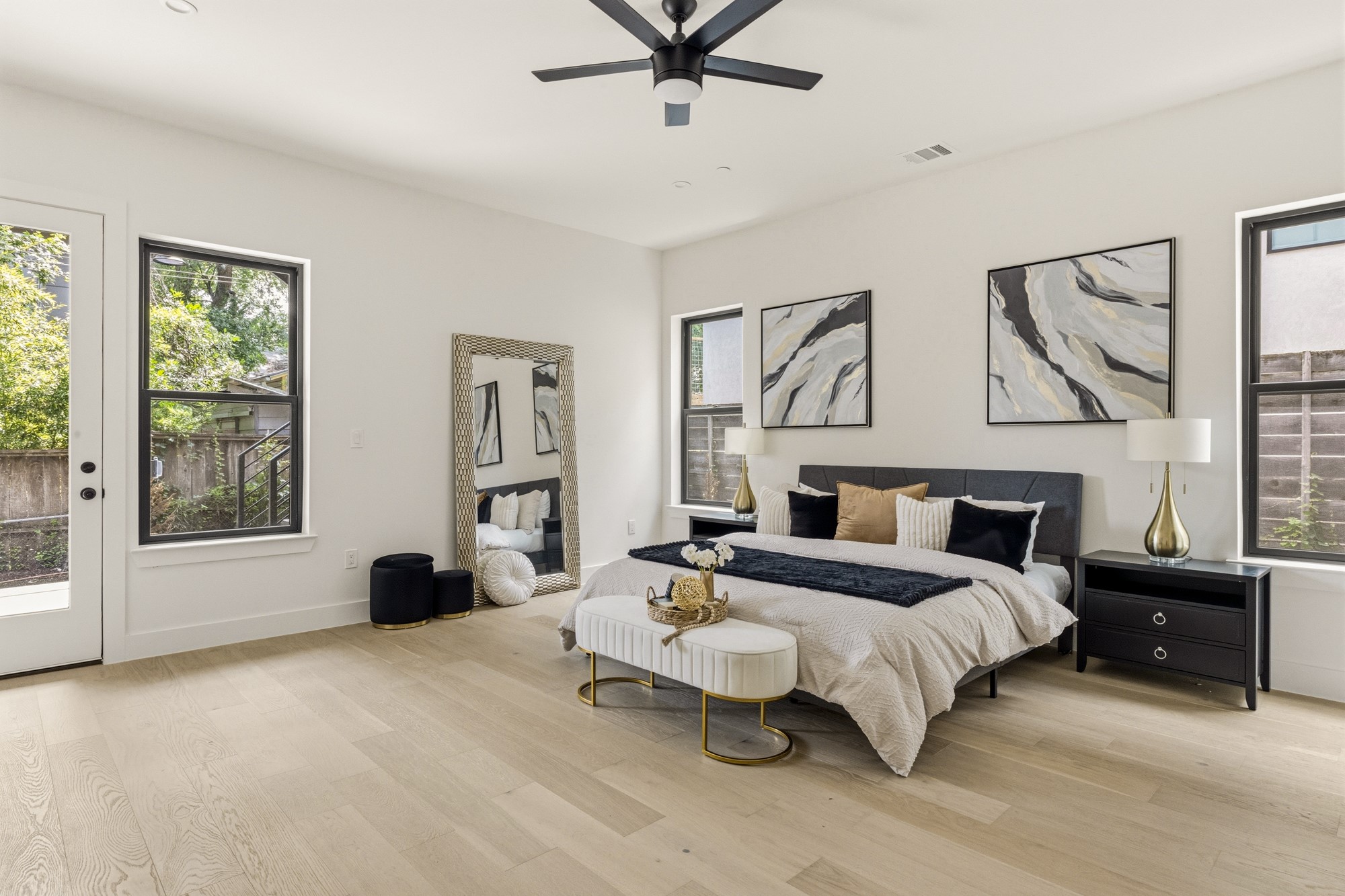 2300 Bluebonnet Lane Austin, TX 78704 - Photo 15 of 40 a spacious bedroom with a bed a couch and a window