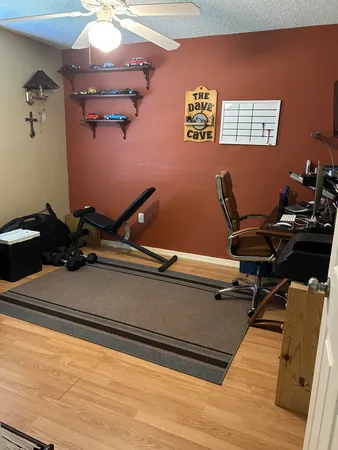 a living room with couch and a flat screen tv