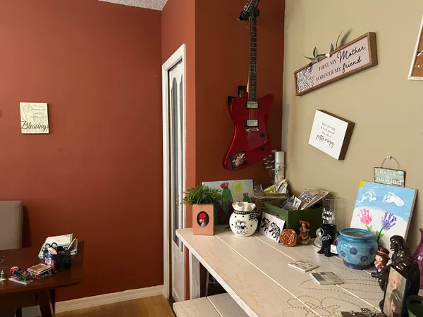 a living room with furniture and kitchen view