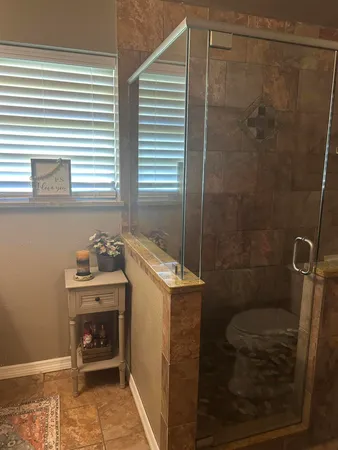 a kitchen with a dining table chairs sink and cabinets