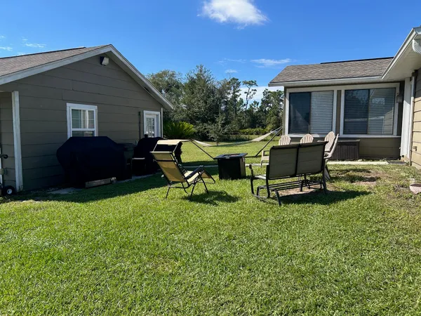 a room with furniture window and book shelfs