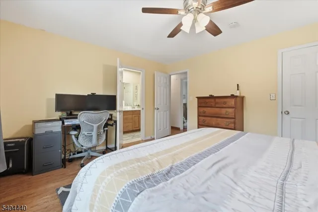 a bedroom with a large bed and a tv