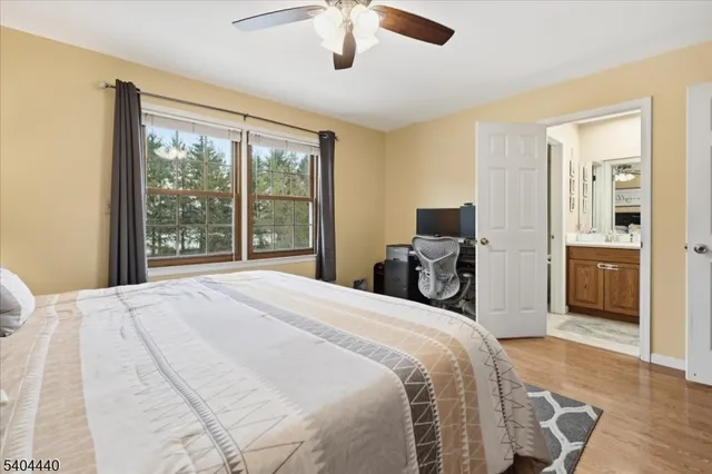 a bathroom with double vanity sink and a mirror