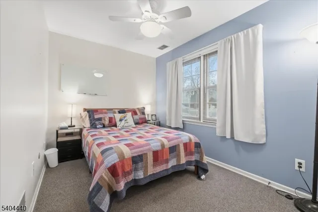 a bedroom with a bed and a mirror