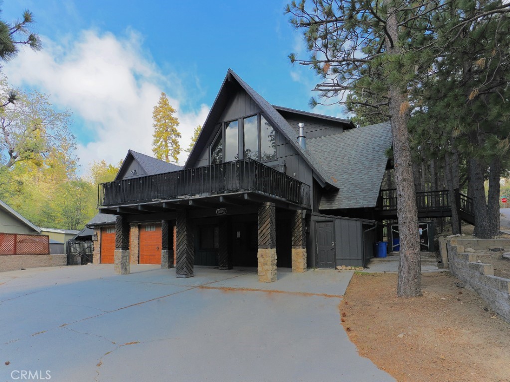 28596 North Bay Road Lake Arrowhead, CA 92352 - Photo 2 of 69 a front view of a house with a porch