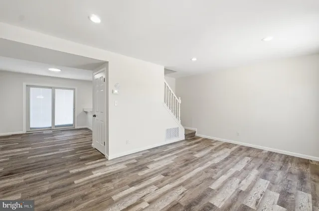 a view of empty room with windows