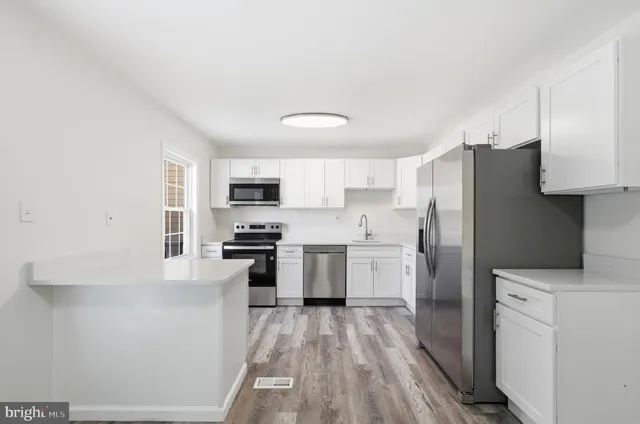 a view of an empty room with stairs