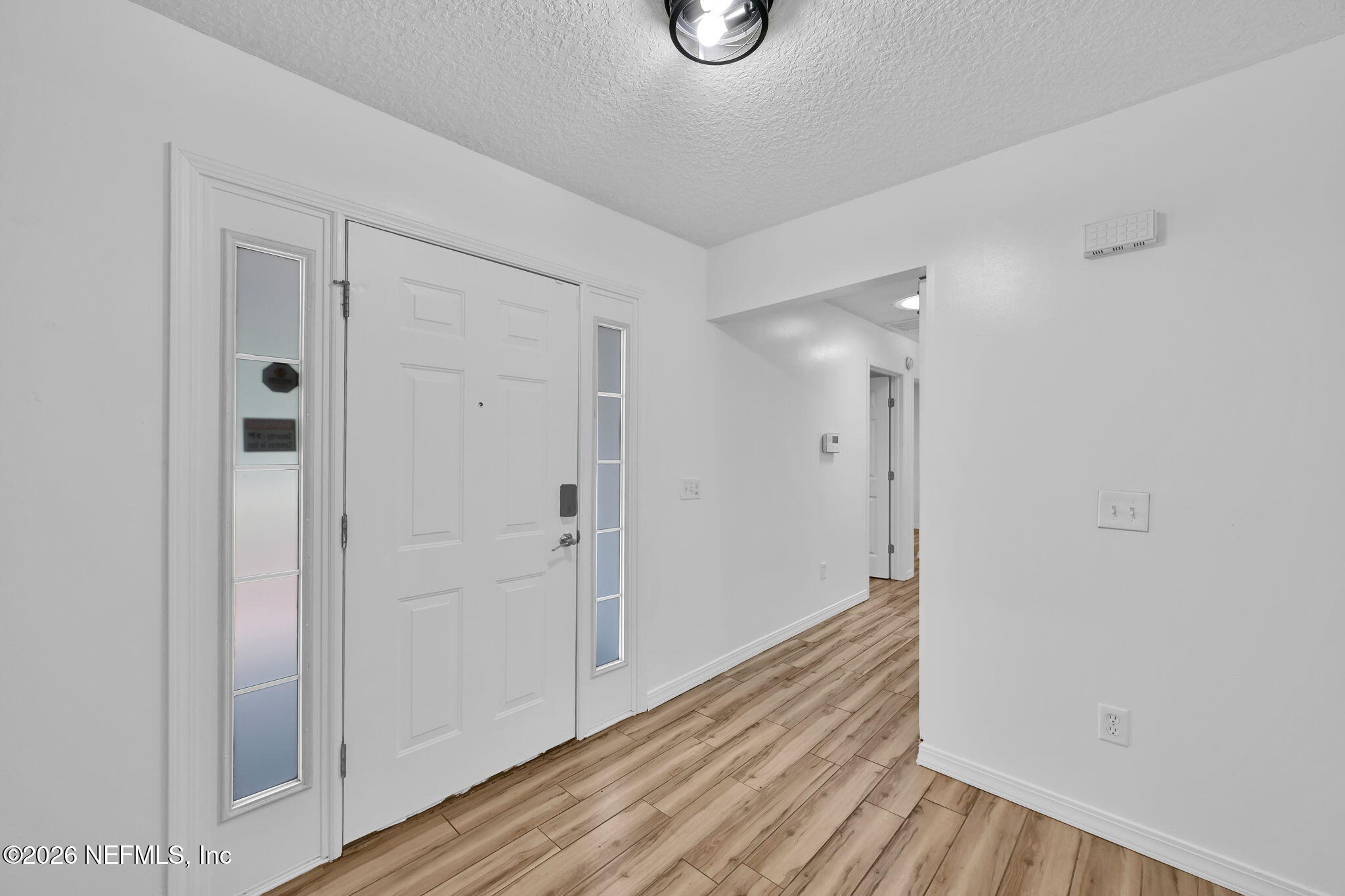 1110 Woodlawn Road, Unit D St. Augustine, FL 32084 - Photo 11 of 40 a view of a hallway with wooden floor
