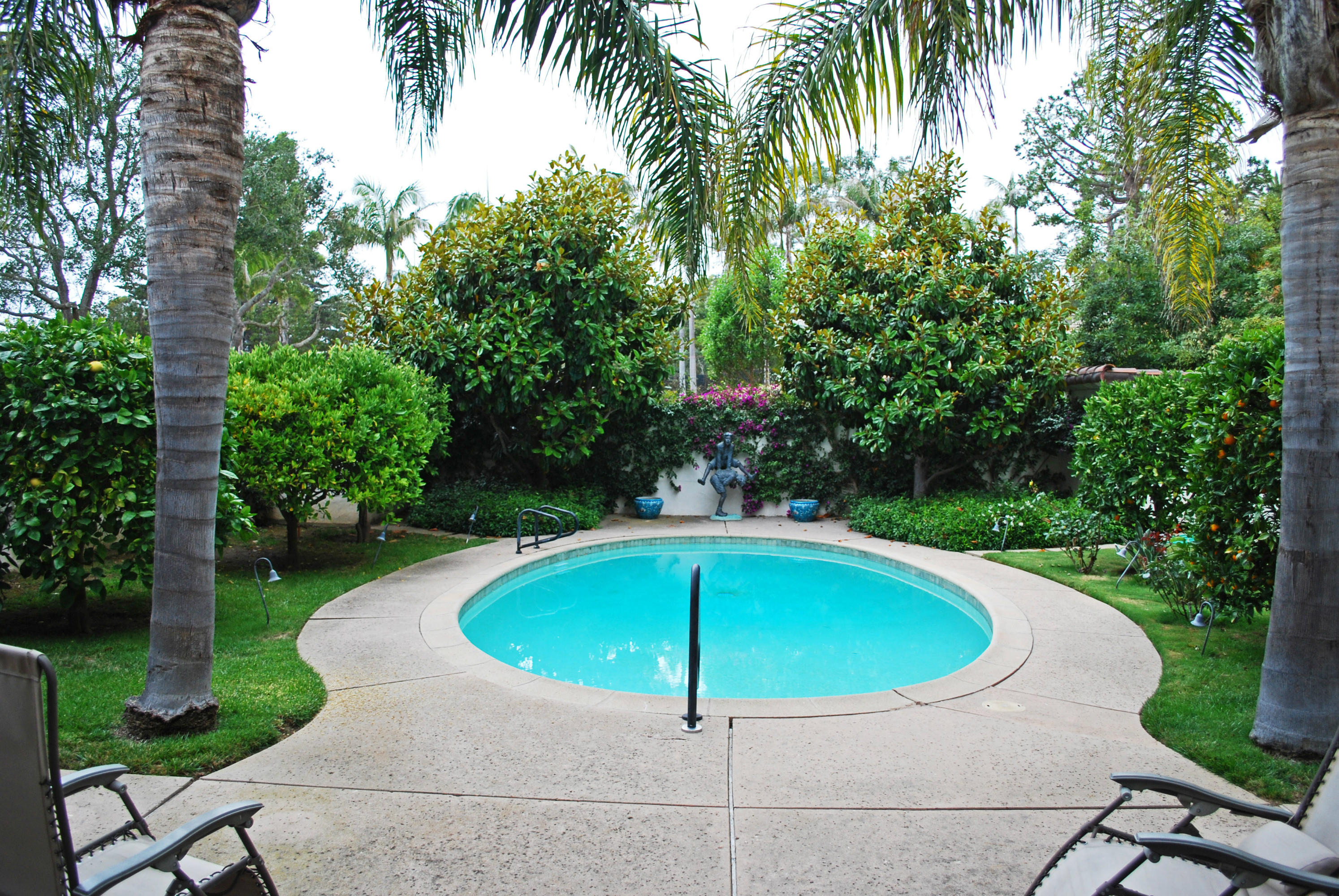 1920 Boundary Drive Montecito, CA 93108 - Photo 9 of 10 a table and chairs in backyard of house