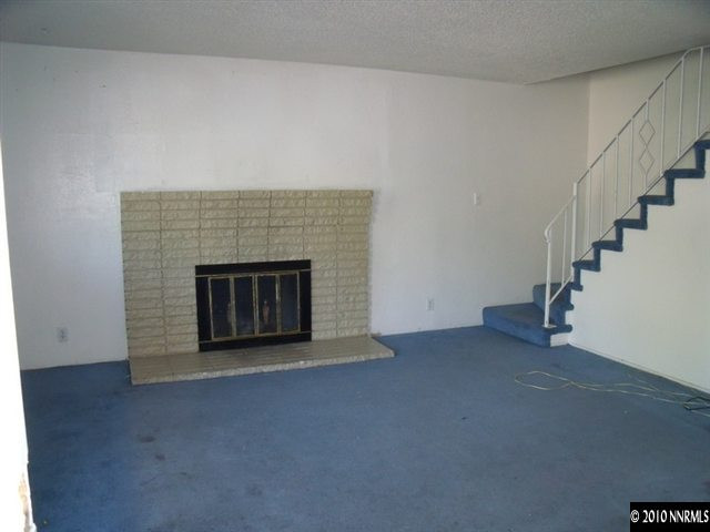 1075 Monitor Drive Reno, NV 89512 - Photo 2 of 6 a view of empty room with a fireplace