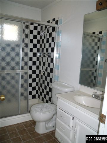 1075 Monitor Drive Reno, NV 89512 - Photo 4 of 6 a bathroom with a sink a toilet and shower