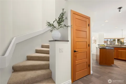 a view of kitchen with furniture and wooden floor