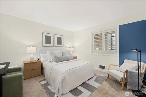 a bedroom with a bed and a couch