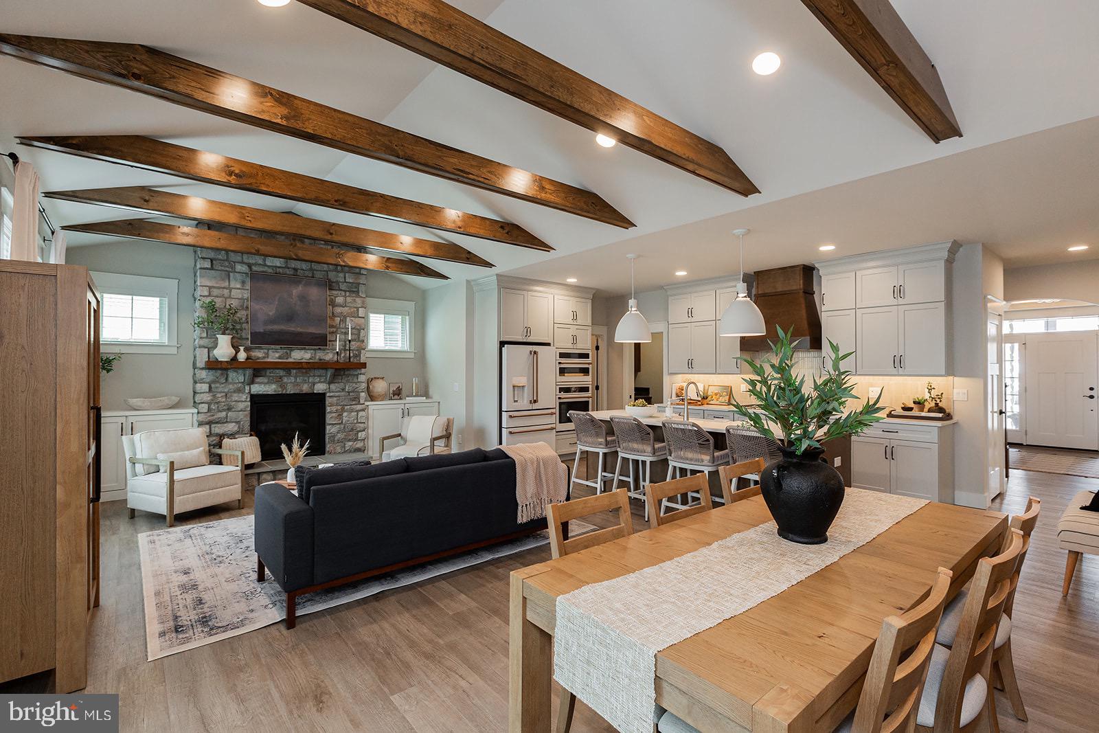 a view of a dining room with furniture and a fireplace