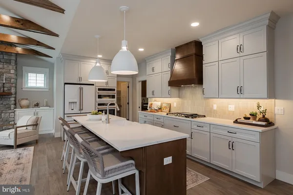 a kitchen with a sink stove and refrigerator