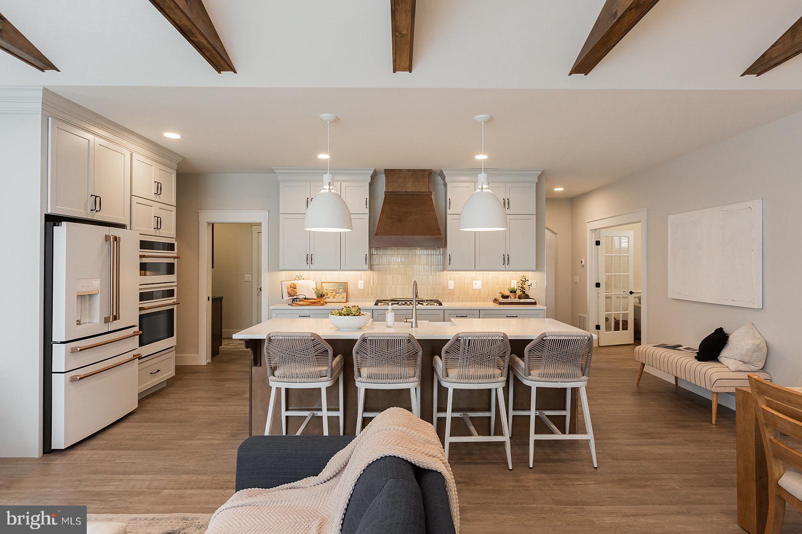 618 Greenbriar Path Cochranville, PA 19330 - Photo 15 of 49 a view of a dining room with furniture wooden floor and chandelier