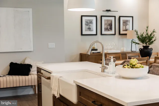 a kitchen with a sink cabinets and a stove