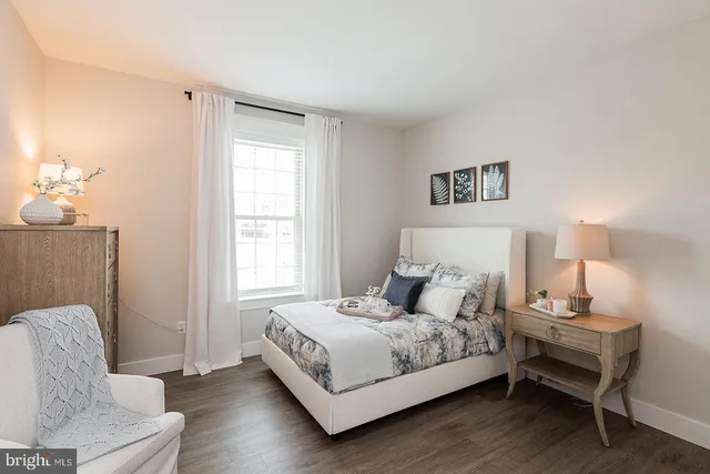 a bedroom with a bed and a couch