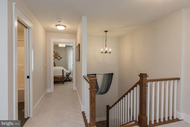 a view of a hallway view with staircase