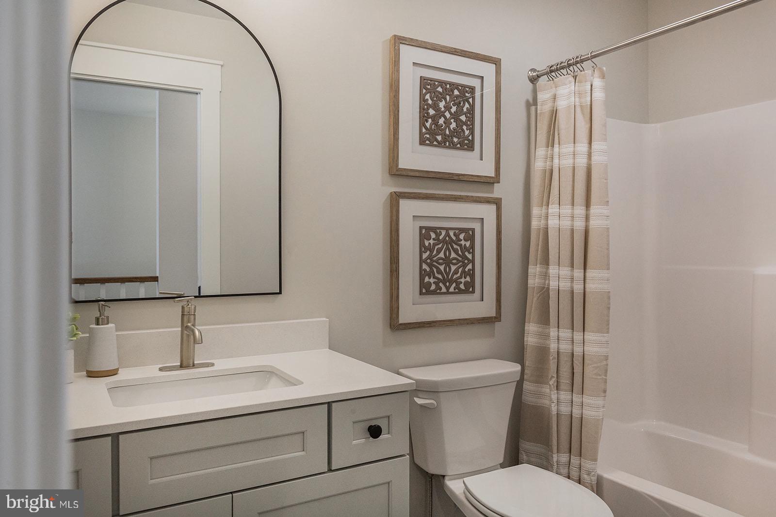 618 Greenbriar Path Cochranville, PA 19330 - Photo 37 of 49 a bathroom with a toilet sink and shower